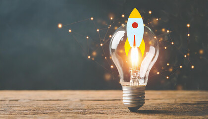 Rocket launch idea inside lightbulb with arrows up. strategically planning and initiating a corporate startup. aim to achieve objectives through value development, fostering leadership - obrazy, fototapety, plakaty