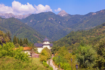 Fototapeta na wymiar Beautiful mountain landscape on sunny autumn day. Montenegro. View of ancient Moraca Monastery