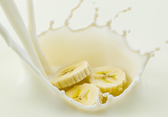Banana falling with Milk splash