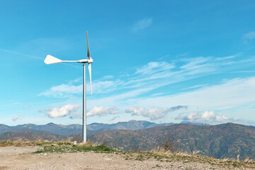 Green energy concept. Мountain top industrial wind power plant, wind turbine for generation electricity in wind farm or wind park.