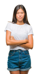 Young asian woman over isolated background thinking looking tired and bored with depression problems with crossed arms.