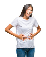 Young asian woman over isolated background with hand on stomach because indigestion, painful illness feeling unwell. Ache concept.