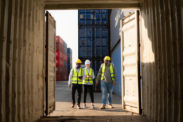Group of workers in an empty container storage yard, The condition of the old container is being...