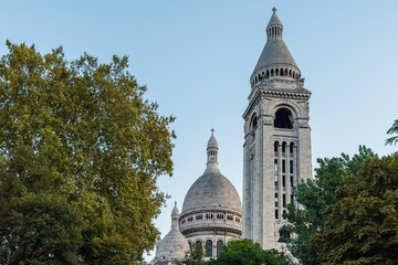 Dome and bell tower of Basilica of Sacre Coeur de Montmartre, Paris, France at sunset. Roman...