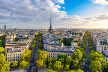 Aerial view of Paris with Eiffel Tower and Champs Elysees from the roof of the Triumphal Arch. Panoramic sunset view of old town of Paris. Popular travel destination - obrazy, fototapety, plakaty