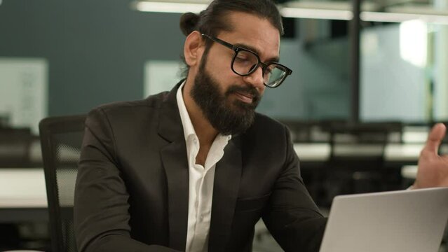 Arabian Man Indian Office Worker At Workplace Table Ethnic Business Entrepreneur Guy Male Businessman Tired Holding Head Laptop Problem Trouble Corporate Failure Stress Bankruptcy Difficulty Headache