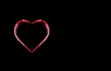red and pink heart halo isolated on a black background