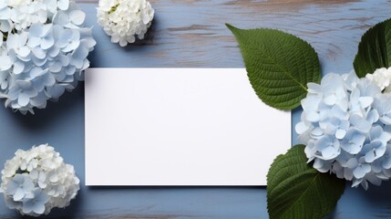A white card surrounded by blue and white flowers