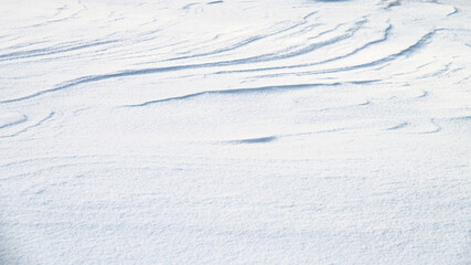 Fototapeta na wymiar Fresh snow texture in blue tone as background.