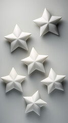 Obraz premium White star shapes, on a light gray background created with Generative Ai