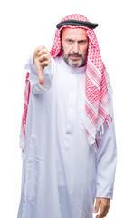 Senior arab man wearing keffiyeh over isolated background looking unhappy and angry showing rejection and negative with thumbs down gesture. Bad expression.