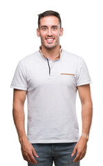 Handsome young casual man wearing white t-shirt with a happy face standing and smiling with a confident smile showing teeth
