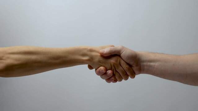 Woman and man shaking hands with trust, support