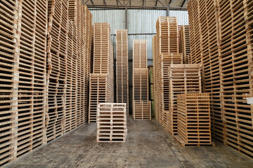 background of pallet wood in warehouse. pattern wood section. Grid of wood squares. the raw of material timber on stack.