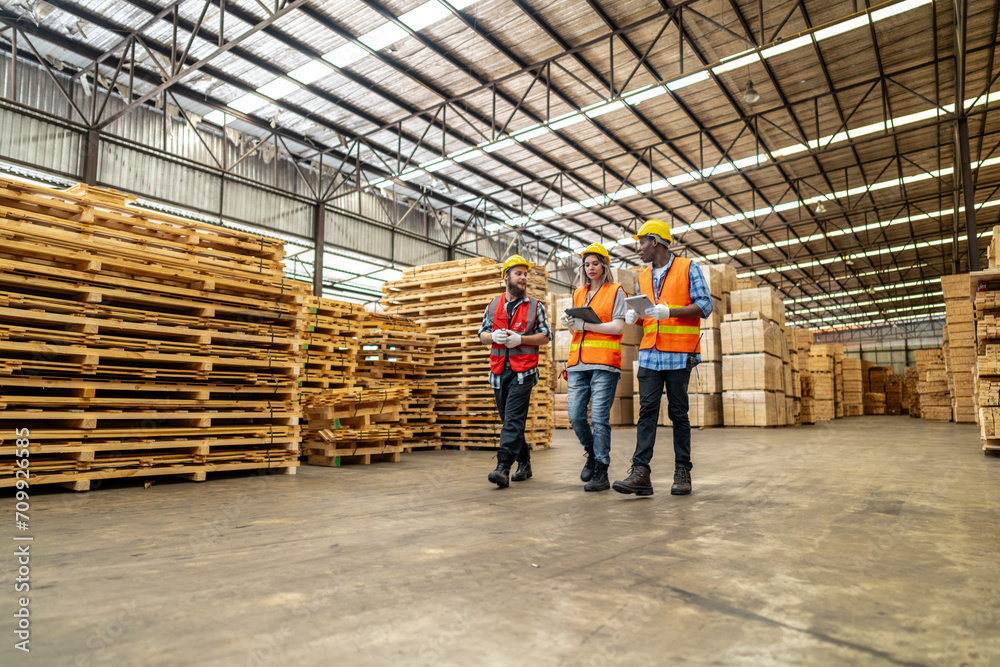 Wall mural workers man and woman engineering walking and inspecting with working suite dress and hand glove in 