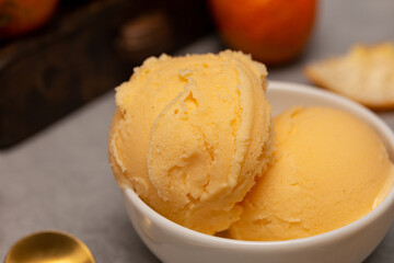 Balls of natural tangerine ice cream