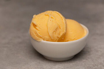Balls of natural tangerine ice cream