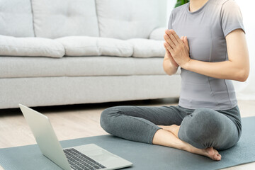 woman practicing meditate in condominium. Asian woman do exercises in morning. balance, recreation,...