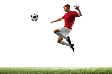 Perfect air kick. Professional soccer player sends ball soaring through air, moment frozen in time...