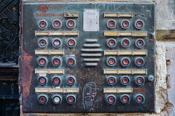 Old, rusty doorbell panel vintage intercom system grundge texture