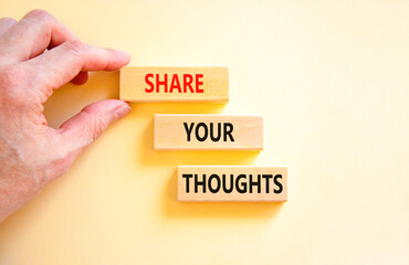 Share your thoughts symbol. Concept words Share your thoughts on beautiful wooden blocks. Beautiful white table white background. Businessman hand. Business share your thoughts concept. Copy space.
