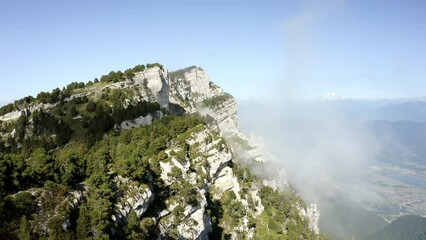 Aerial Forward Idyllic Shot Of Green Trees On Rock Formation During Sunny Day - Chambery, France
