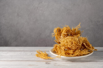 Sea Moss, irish wild harvested dried seaweed, healthy used as food supplement. Copy space