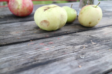 apples on a table in the countryside in summer