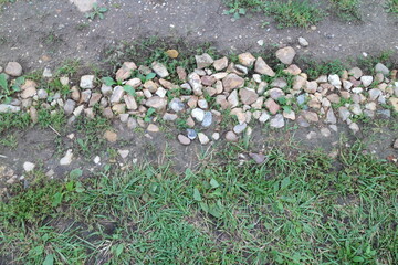 stones on the road village countryside in summer