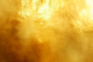 warm-toned abstract image depicting a textured golden surface that could represent a close-up of a...