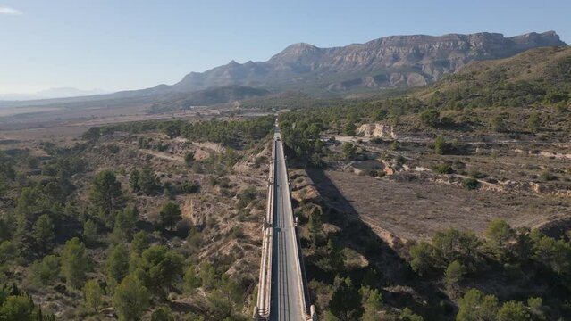 Old bridge on the Maigmó Greenway, a fascinating 22 kilometer route that follows in the footsteps of the old railway route, Alicante, Spain  - stock video