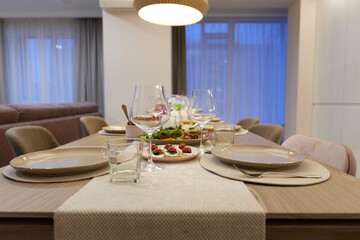 Table served for festive dinner in living room