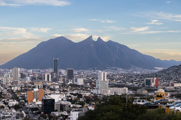 Obraz na płótnie Canvas Cityscape of Cerro de la Silla and the city of Monterrey in the afternoon