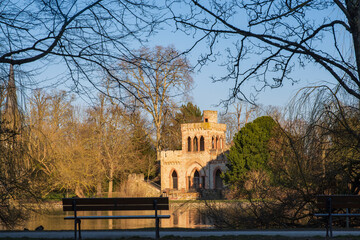 View of the Mosburg, an artificial ruin on the edge of the Mosburgweiher, fed by the Mosbach, in the Biebrich Castle Park in Wiesbaden - obrazy, fototapety, plakaty