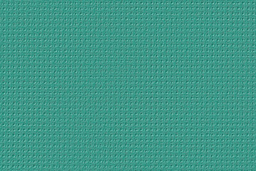 Fototapeta premium Digitally embossed image of green woven aida cloth used for cross stitch