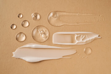Gel, serum and a cream on a a beige background.