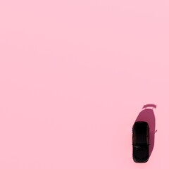 4K Square top view angle a black metalic supercar with Pink pastel color background isolated, JDM...