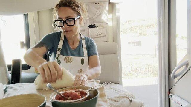 Adult woman lady housewife baker wearing apron kneading flour on kitchen table. Baking pastry concept cooking biscuit cake making bakery making homemade pizza at home