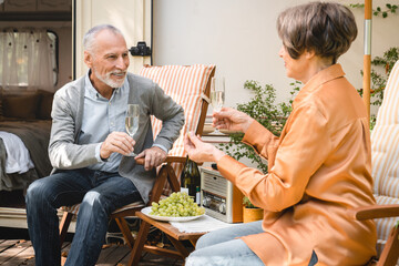 Romantic date of old senior elderly couple spouses spending quality time together celebrating...