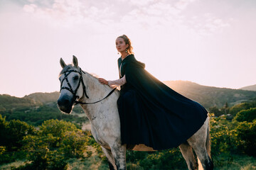 Fantasy story, a young charming girl sitting on a white horse, a fairy-tale portrait of a princess...