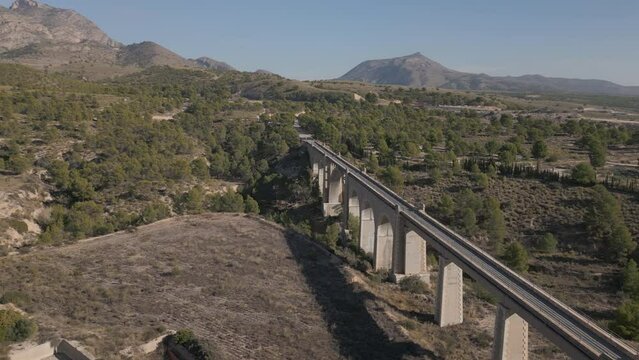 Old bridge on the Maigmó Greenway, a fascinating 22 kilometer route that follows in the footsteps of the old railway route, Alicante, Spain  - stock video