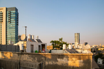 Roof top view in poor area of Tel Aviv. South Tel Aviv style of living. Old dirty buildings with boilers.