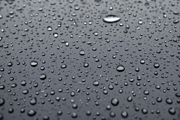 Raindrops on a wet surface