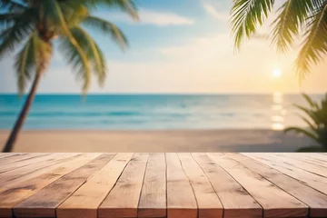  Top of wood table with seascape and palm tree, blur bokeh light of calm sea and sky at tropical beach background © Giuseppe Cammino