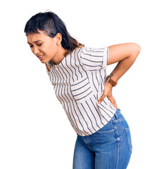 Young woman wearing casual clothes suffering of backache, touching back with hand, muscular pain