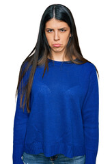 Young hispanic woman wearing casual clothes skeptic and nervous, frowning upset because of problem....
