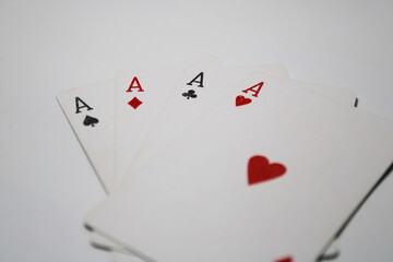Four aces playing cards isolated on white background