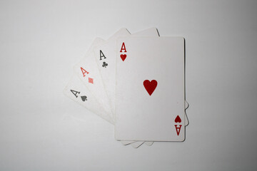 Four aces playing cards isolated on white background