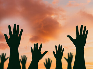 International migrants day concept: Silhouette many people raised hands over autumn sunset background - obrazy, fototapety, plakaty