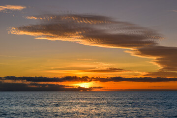 Sunset sky over the sea, panorama with cloud colored sky over blue sea